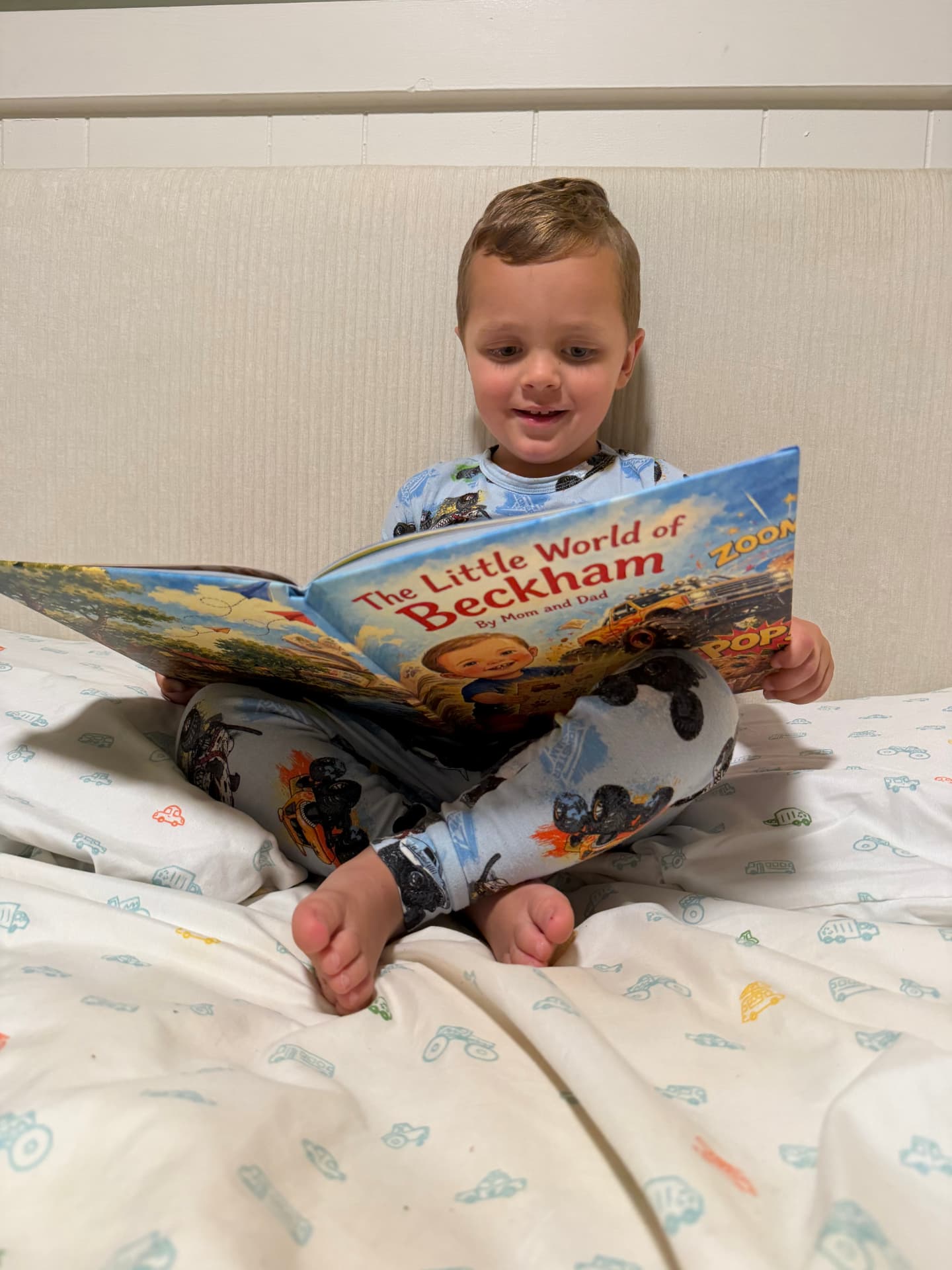 An adult and child reading a personalized hardcover storybook together.