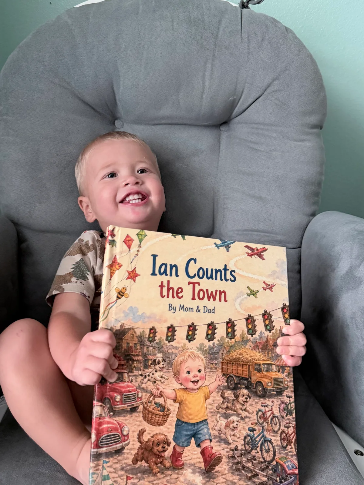 Ian holding his printed Ian Counts the Town book with the cover facing the camera