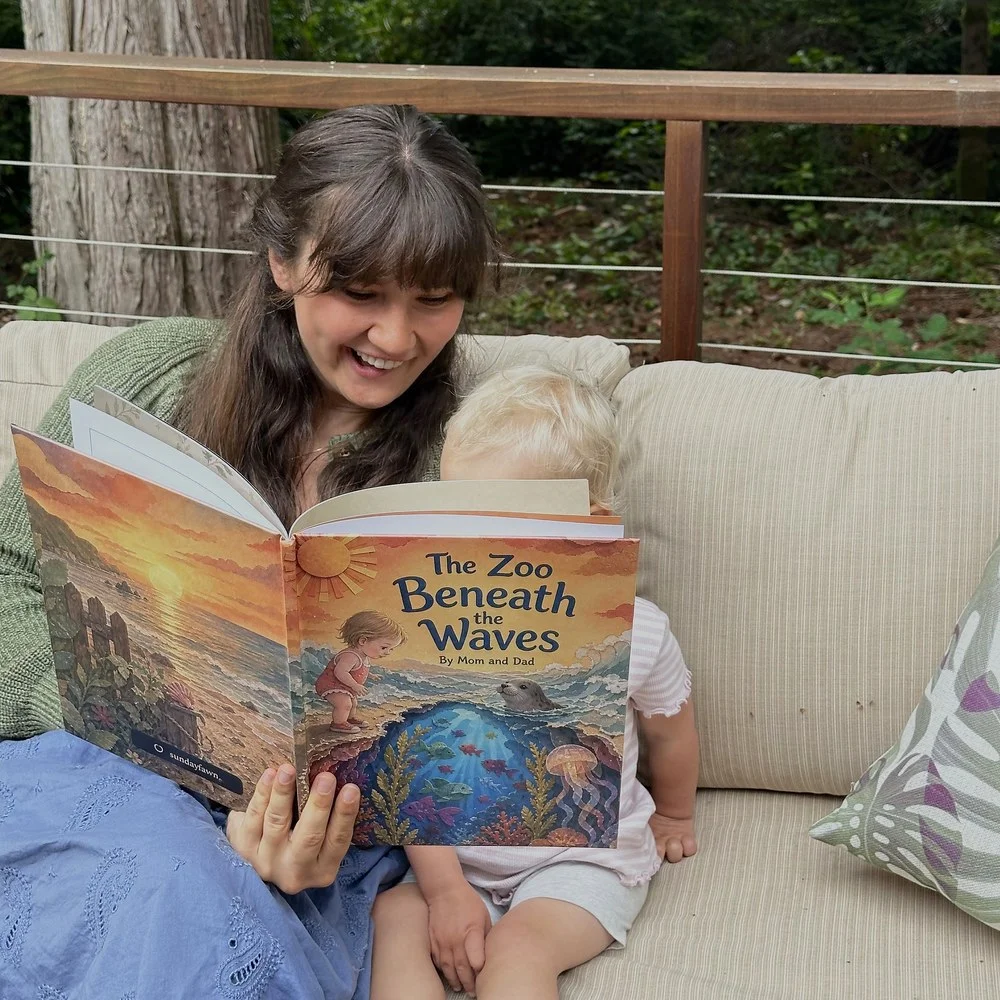 A parent and child reading their printed Sundayfawn book, The Zoo Beneath the Waves, together