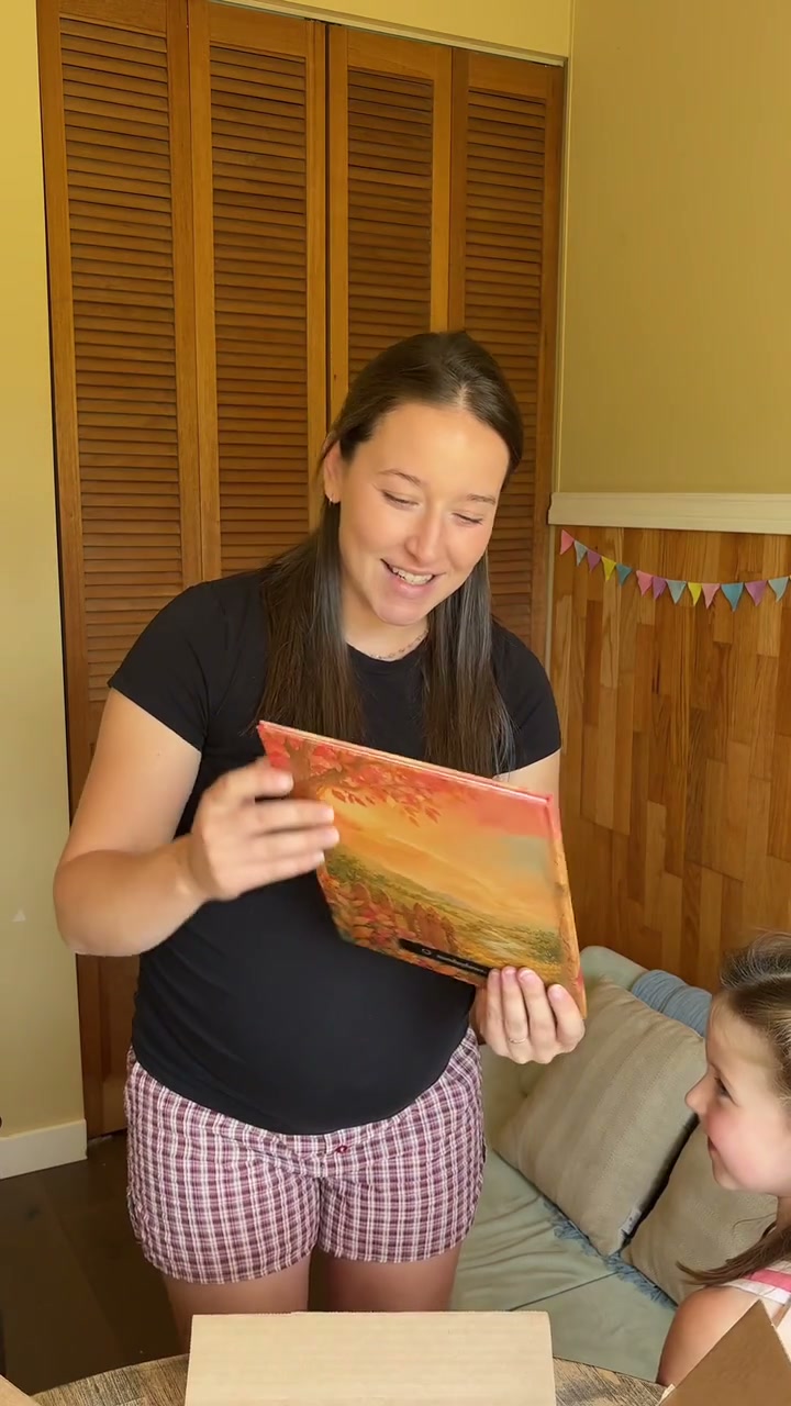 Mikayla and their family with their own Sundayfawn book
