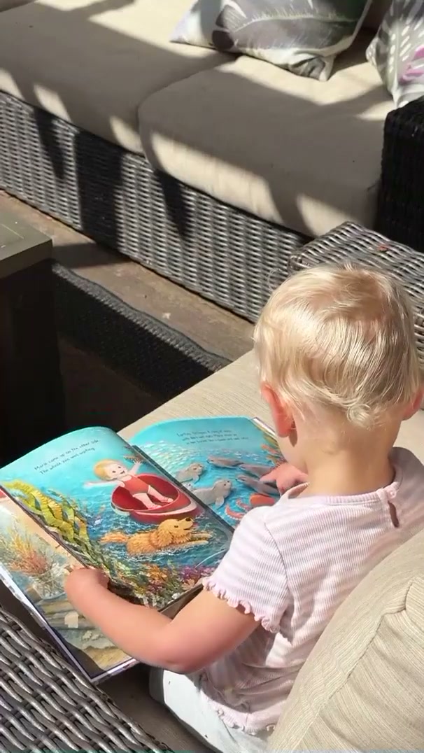 Nikki and their family with their own Sundayfawn book
