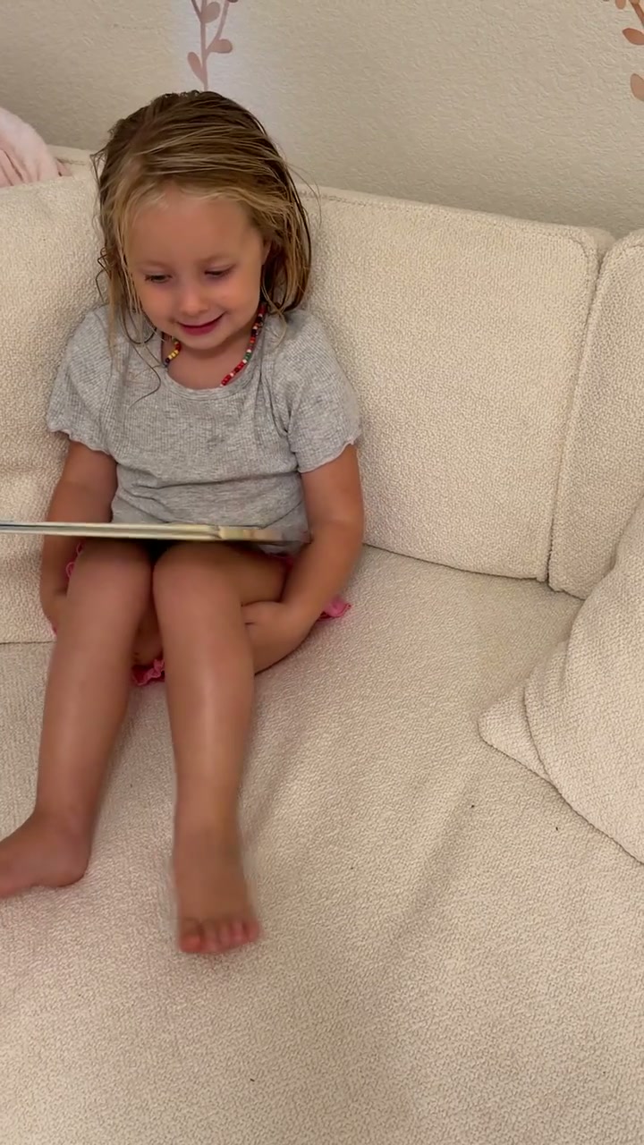 Cassidy and their family with their own Sundayfawn book